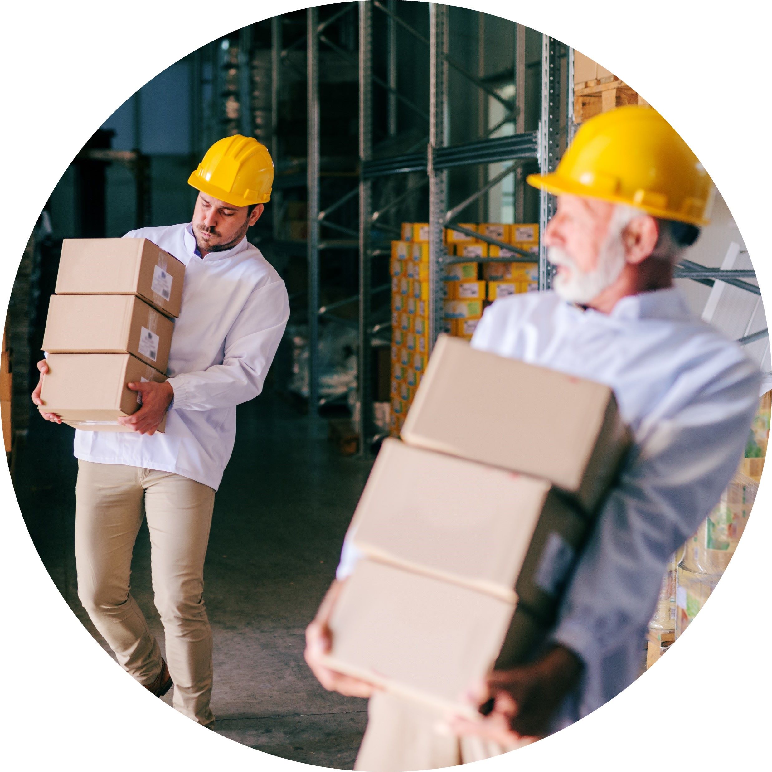 two men in hard hats lifting boxes