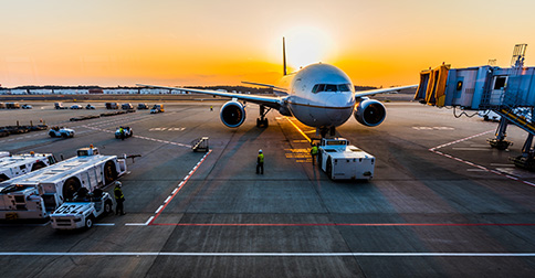 airplane-at-airport-with-sunset
