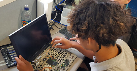 Teenager_fixing_laptop