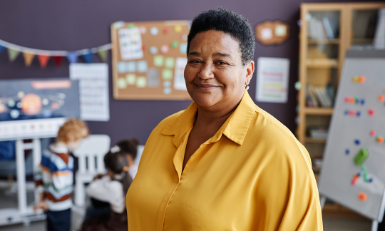 Smiling woman in yellow shirt