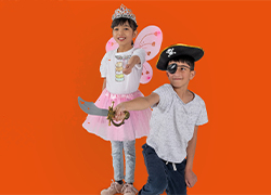 A picture of two kids dressed up on orange background