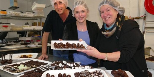 Chocolate and confectionary consultant Mark Tubman, from Sydney, working with The Seriously Good Chocolate Company owner Jane Stanton, right, and Venture Southland business relationsip co-ordinator Rachel Butler.