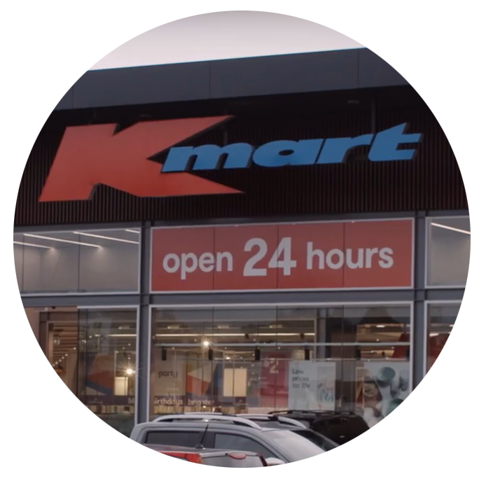 Photo cropped into a circle of a sign on the outside of a Kmart store